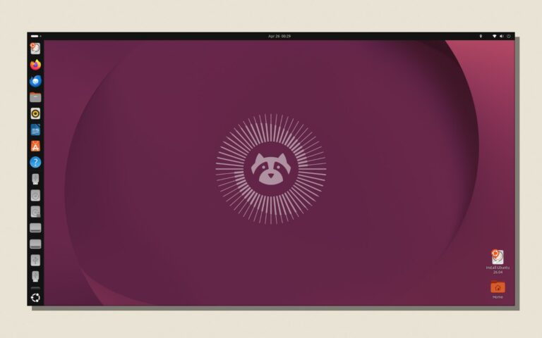 Capture du bureau GNOME d Ubuntu 26.04 LTS, posee sur un fond papier avec une ombre portee